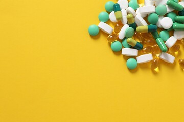 Different pills on a color background
