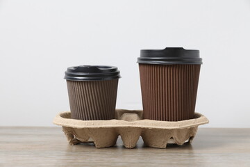 Paper cups of coffee on the table