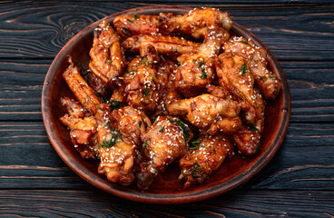 Caramelized in sause chicken wings  . Bar-b-q food background photo
