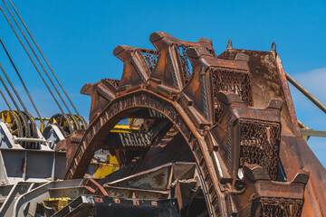 Digging machine, coal mining machine, huge mining equipment. metal machine for mining non-ecological coal. pile of metal, scrap. driving ropes, control cabin © Adam