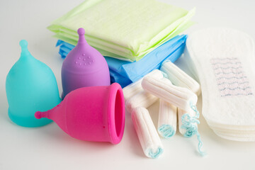 Menstruation cycle with sanitary pad, cotton tampon and menstrual cup for woman hygiene and protection. © amazing studio