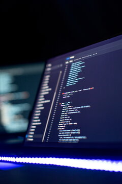 Modern tech. PHP syntax highlighted. Writing programming functions on laptop. Big data and Internet of things trend
