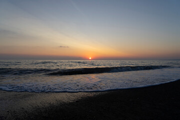 Obraz premium Sunset at the Mediterranean Sea in Marina di Bibbona in Tuscany in Italy