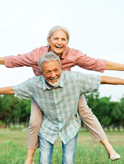 woman man outdoor senior couple happy lifestyle retirement together smiling love fun elderly active...