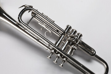 One trumpet on light background, top view