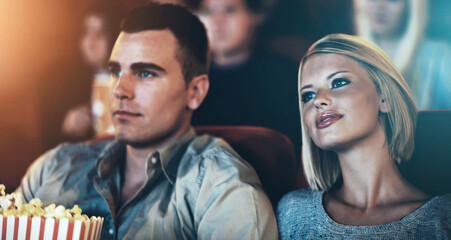 Date, popcorn and couple at theater for watching movie, eating or romantic night together. Lens...
