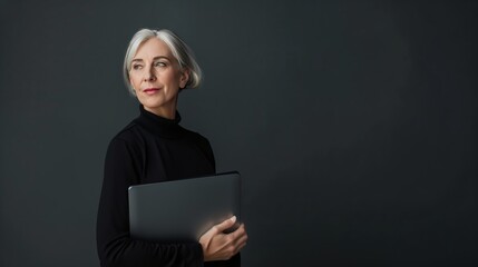 middle aged elegant minimalistic woman wearing holding laptop on simple background on studio background --ar 16:9 --stylize 50 Job ID: 835e63db-9b00-4c85-8602-b6294b0e4629
