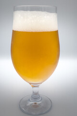 Glass of beer on a white background.

