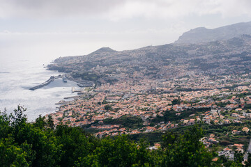 Obraz premium Funchal city of Madeira island Portugal with fortress on the coast of Atlantic Ocean. Aerial view