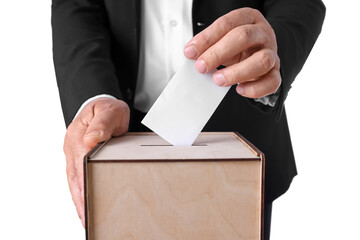 Man putting his vote into ballot box against white background, closeup