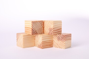 Many blank wooden cubes isolated on white