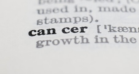 Cancer definition in the dictionary close-up, shallow depth of field and selective focus.