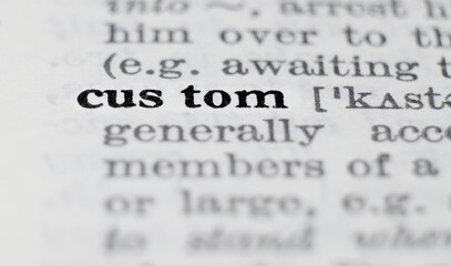 Custom definition in the dictionary close-up, shallow depth of field and selective focus.