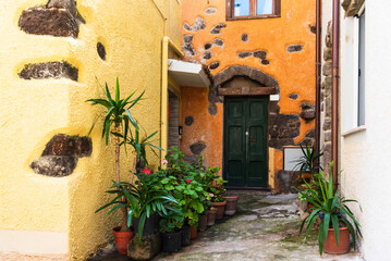 Street photography, beautiful alley of Castelsardo old city - Sardinia - Italy.