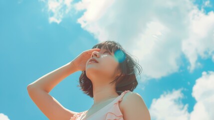 Naklejka premium The woman under blue sky