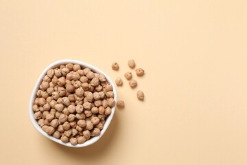 Raw chickpeas on colored background. Healthy and natural vegetarian food