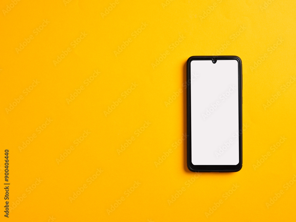 Poster smartphone template with blank white screen on yellow background. top view with copy space.