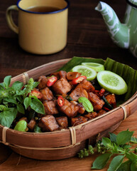 Tempe orek is a popular Indonesian dish made from sliced, fried tempeh sautéed with garlic, shallots, and sweet soy sauce, offering a savory, slightly sweet flavor.