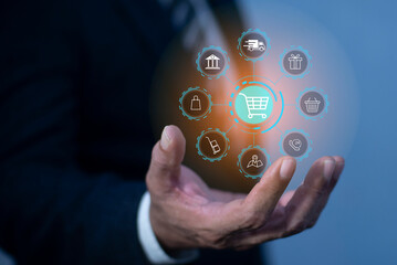 Businessman holding shopping online, shopping cart icon on screen. E-commerce payment on internet. online supermarket gadget. Credit card safe, online business, convenience, competitive price