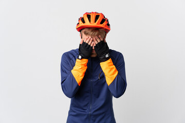 Young cyclist blonde man isolated on white background with tired and sick expression