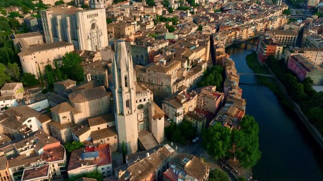 drone view of Spanish historic town of Girona at sunset, tourism in Spain Costa Brava, aerial view of gothic cathedral and river in Girona