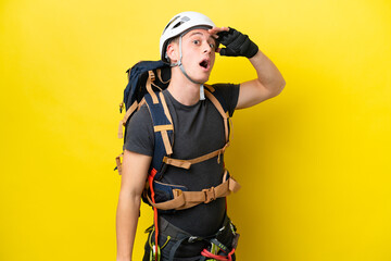 Young rock climber Brazilian man doing surprise gesture while looking to the side