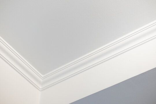 Detail of white ceiling cornice, crown molding
