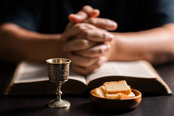 Sacred ceremony of Communion, Christians express their faith by partaking in holy bread, deepening...