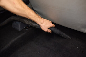 Car interior cleaning includes thorough cleaning under pedals for a tidy interior