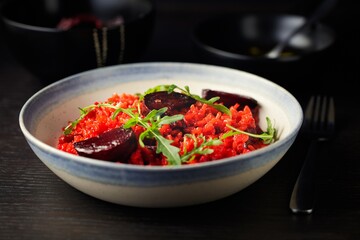 Gourmet Delight: Close-Up 4K Image of Healthy Vegan Beetroot Risotto with Garlic Rosemary Oil and Rocket Leaf Garnish
