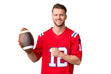 Young caucasian man playing rugby over isolated chroma key background celebrating a victory