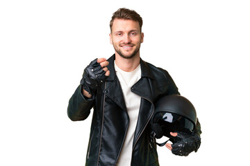 Young caucasian man with a motorcycle helmet over isolated chroma key background making money gesture