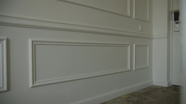 white decorative moldings on the wall in hotel