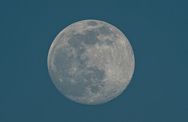 Full Moon shining bright in the clear night sky, revealing its celestial beauty and ethereal glow
