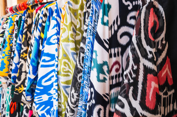 traditional indian dresses made of silk fabric with a bright colorful pattern at oriental bazaar in...
