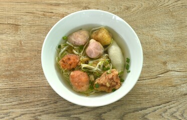 boiled Hakka meatball made from chop pork stuffing fried tofu with bean sprout and lettuce in soup on bowl