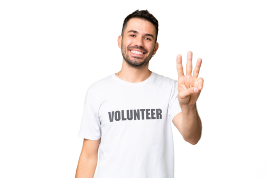 Young volunteer caucasian man over isolated chroma key background happy and counting three with fingers