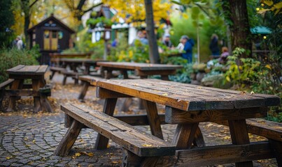 Fototapeta premium Rustic wooden bench in a beer garden at the Oktoberfest festival.