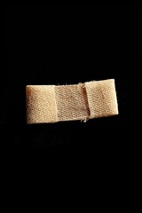 Obraz premium A piece of cloth with a piece of cloth sticking out, torn or frayed edge