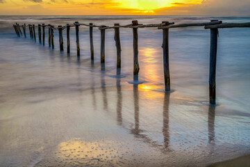 Sunset at Beach with Fence in Donana National Park