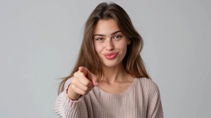 Fototapeta premium Smiling Woman Pointing at the Camera
