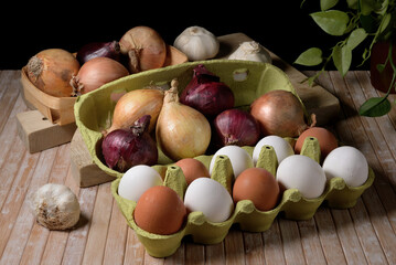 Different colored eggs and onions