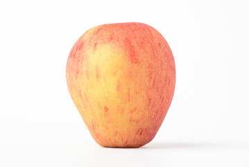 Fresh ripe apple with tiny water drops on white background