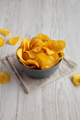 Bacon Flavored Potato Chips in a Bowl, side view.