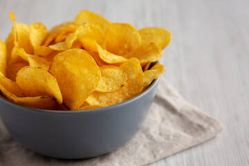 Bacon Flavored Potato Chips in a Bowl, low angle view. Copy space.
