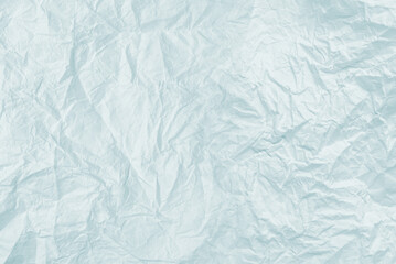 Crumpled white paper background.