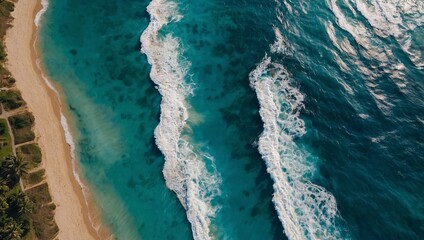 Summer beach top-down view with blue water waves and sun reflections, high contrast