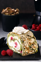 meringue roll with pistachios and fresh raspberries