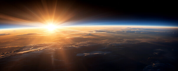 A breathtaking view of sunrise over the Earth, showcasing a vibrant atmosphere and the beauty of our planet from space.
