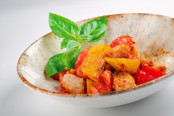 Vegetable ratatouille with potatoes, sweet peppers and tomatoes